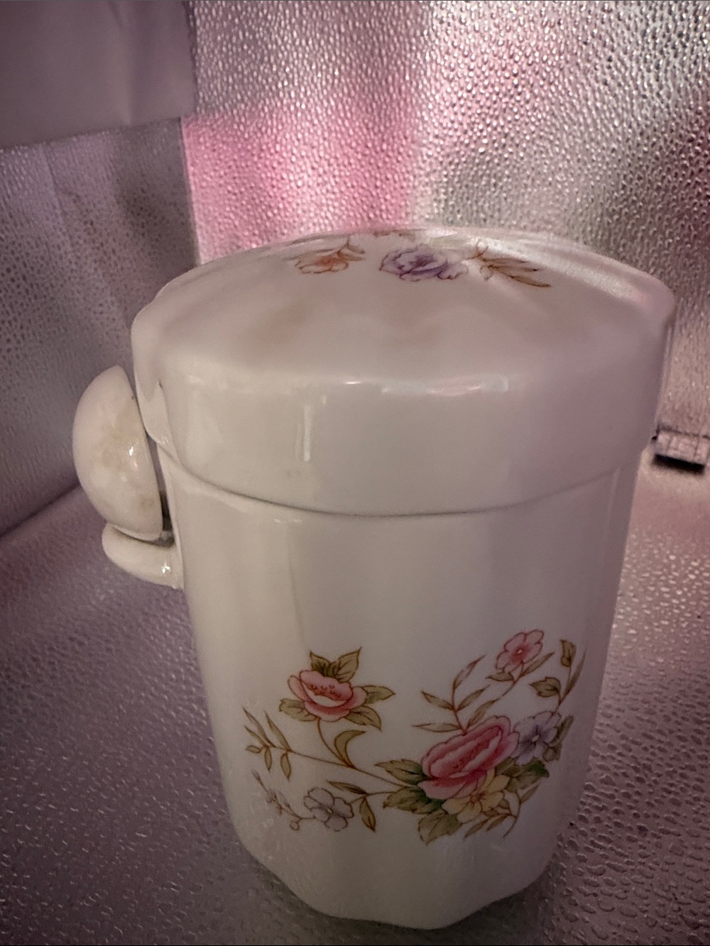 Vintage Floral Ceramic Canister with Lid has a floral design.
